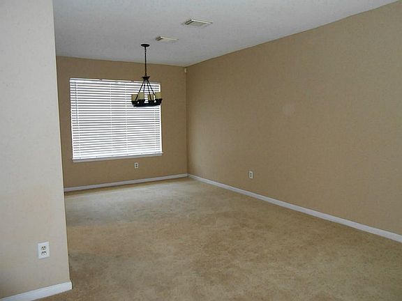 Formal dining with updated light fixture.