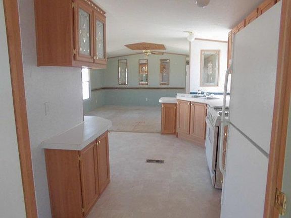 View from Hallway through kitchen into living area