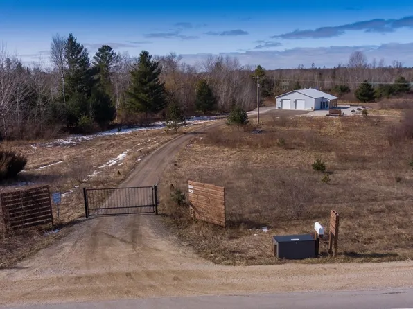 7524 Cherry Ave, Kewadin, MI 49648