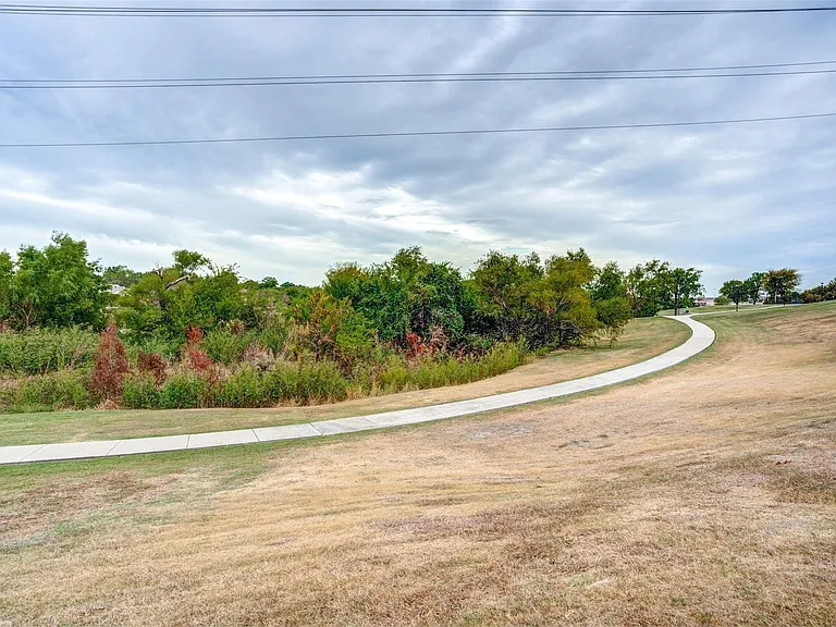 Walking trail, creek and park behind the house.