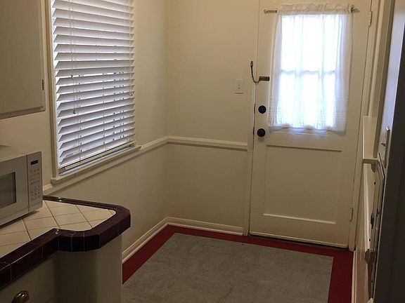 Breakfast area and rear door in kitchen- Microwave not included