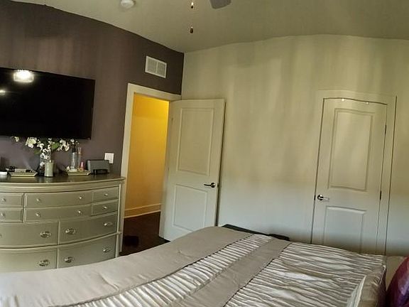 Spacious master bedroom with rare balcony.