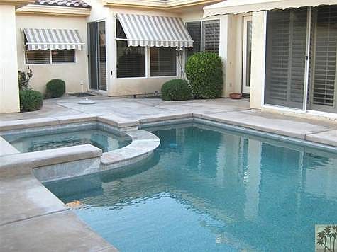 The entry courtyard provides total privacy at the pool