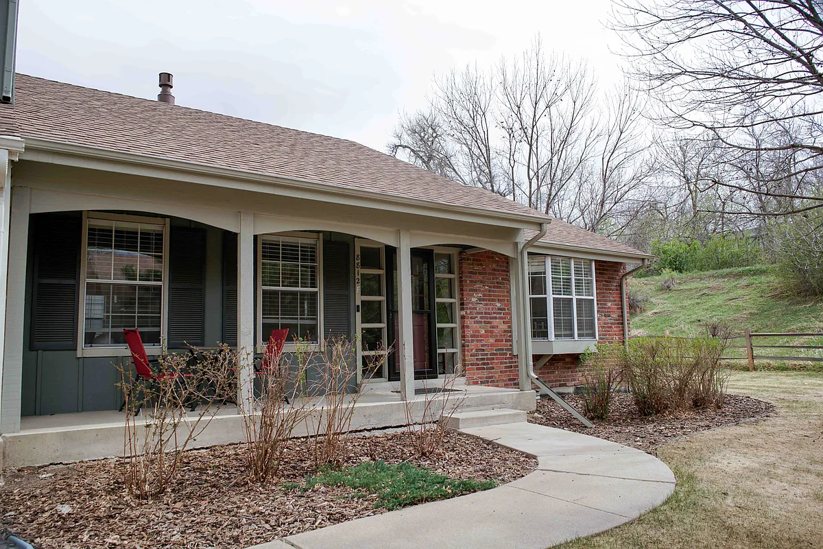 Front of house. This is the last unit on the row of townhomes with an open greenbelt on the side of the house. - 8812 E Amherst Dr #F