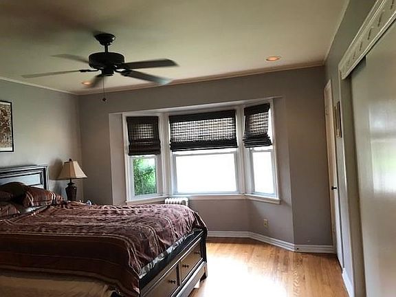 Master bedroom with bay window and attached half bath