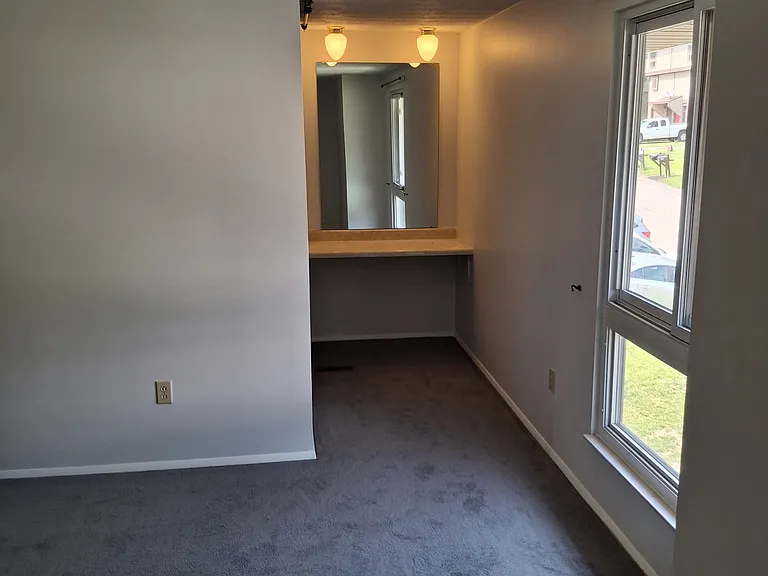 Spacious Master Bedroom with dressing/makeup vanity.