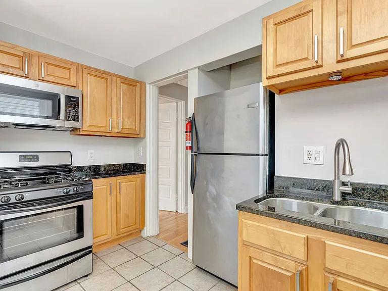 Gas stove, garbage disposal, and built in microwave.