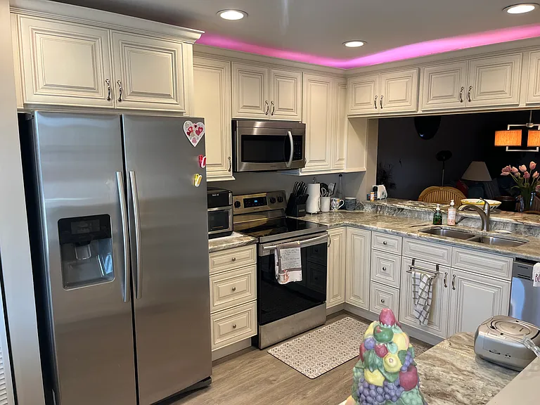 Updated kitchen with stainless steel appliances.
