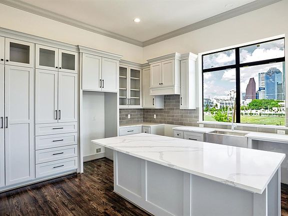 Sample of photo to show construction quality from 1510 Saulnier B. The kitchen is located on the second floor. The kitchen cabinets are custom-built Shaker-style with satin nickel knobs and pulls, Quartz countertops and soft-closed drawers and cabine