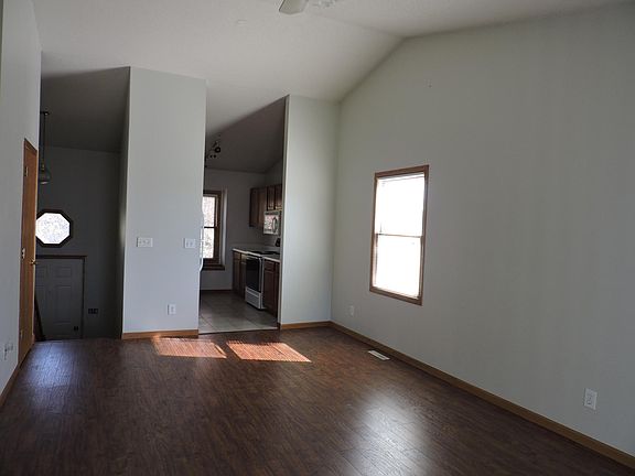Upper Level Living Room/Dining Area with Kitchen view.