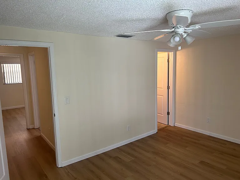Master Bedroom view looking from sliding glass door to balcony