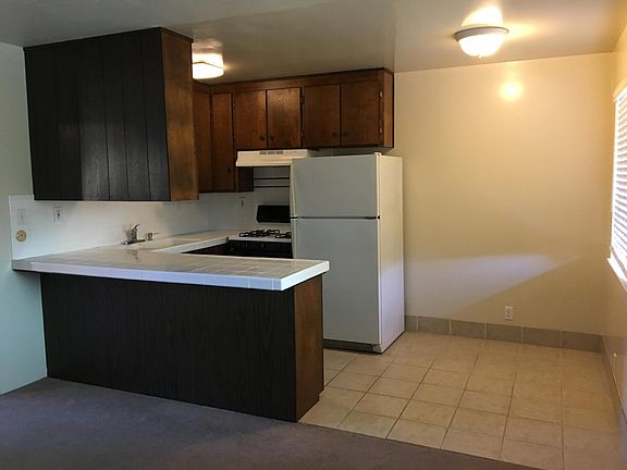 Kitchen includes gas stove, fridge 