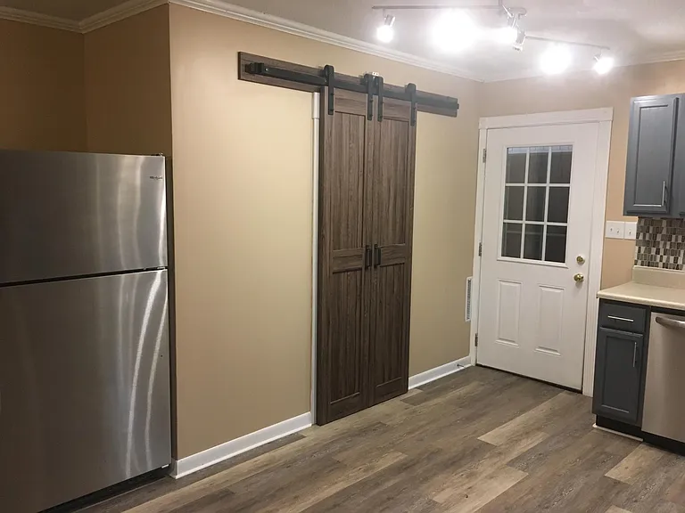 Laundry closet with custom barn door entrance