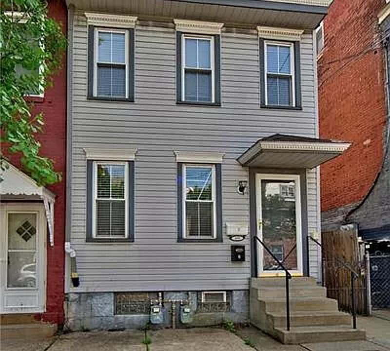 Street view of duplex. Top two floors are Unit 2