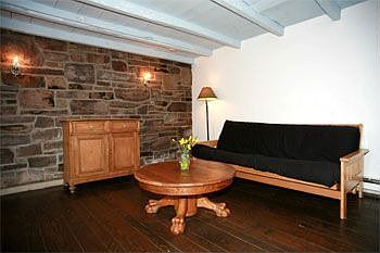 Exposed stone wall in downstairs