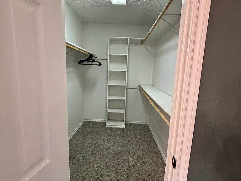 Primary rooms walk in closet