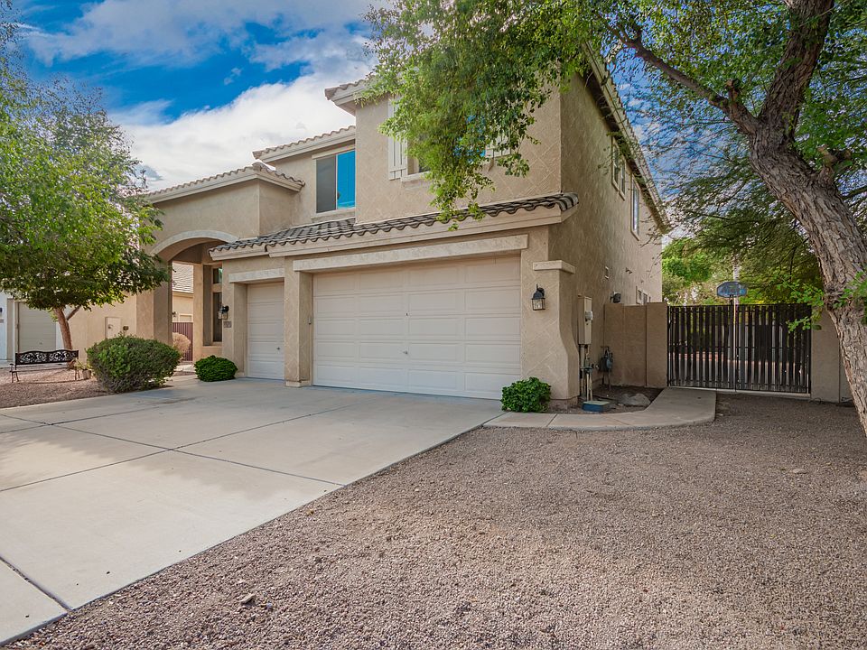 3 Car Garage with RV Gate and large cement pad inside for basketball and your toys.