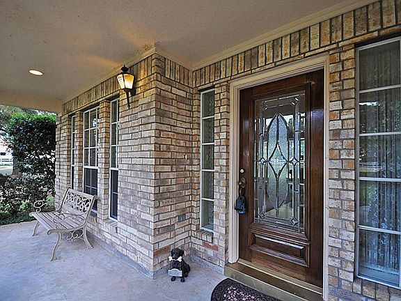 Close up of large, serene covered front porch.