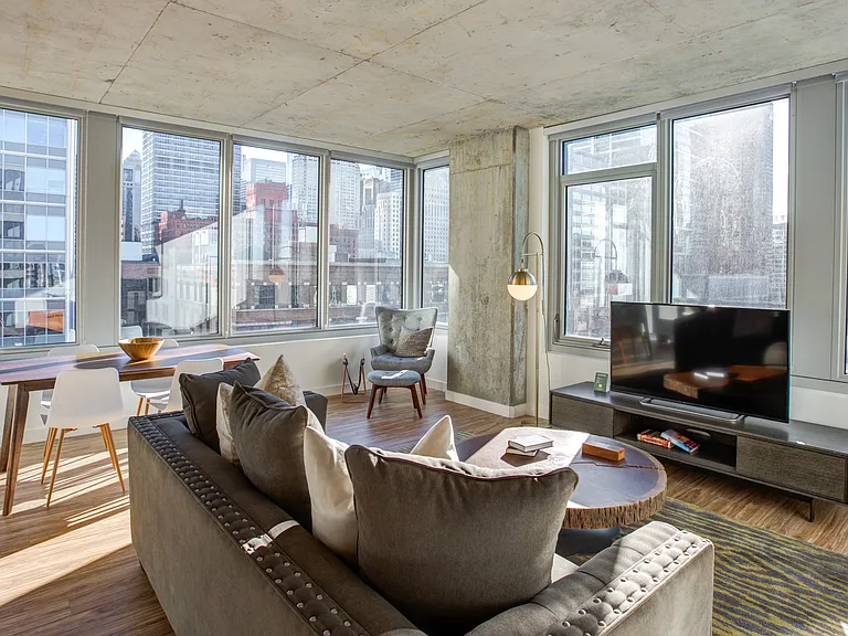 Soak in skyline views from the comfort of this light-filled living room.