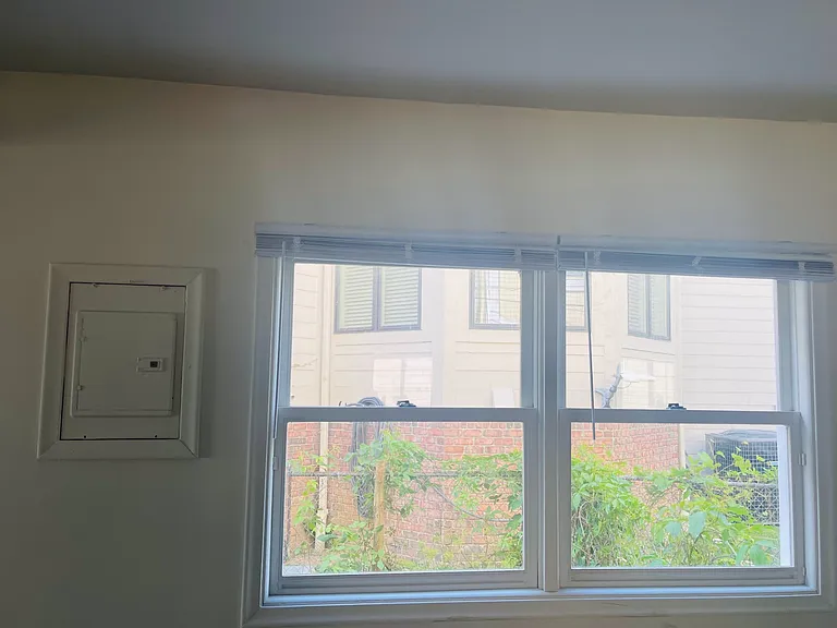 Plenty of light in the living room from the front windows, sliding door, and these windows. Fuse box is easy to access (probably cover it with a picture ;)