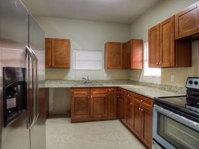 Kitchen with newer stainless steel appliances. Dishwasher is brand new.