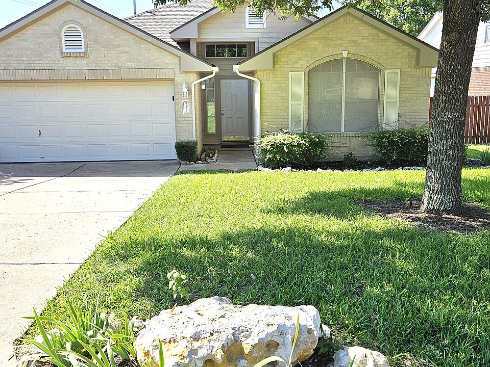 Frontal view. Two car garage with garage door opener.