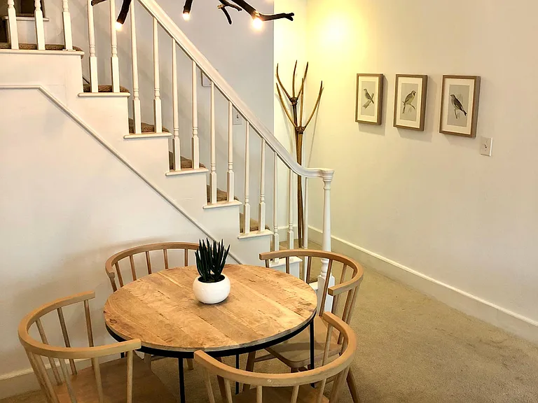 Dining with new modern furniture & West Elm branch chandelier.