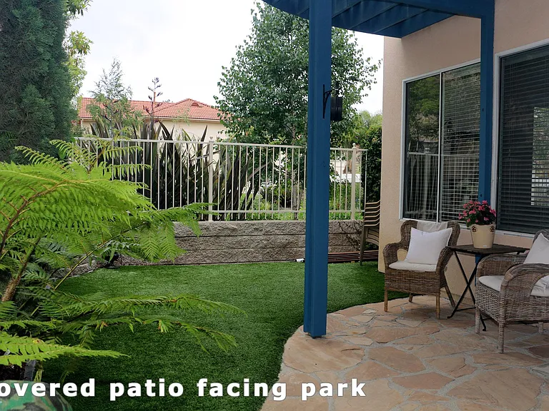 Private and enclosed patio with view of the park. Lawn turf for easy maintenance.