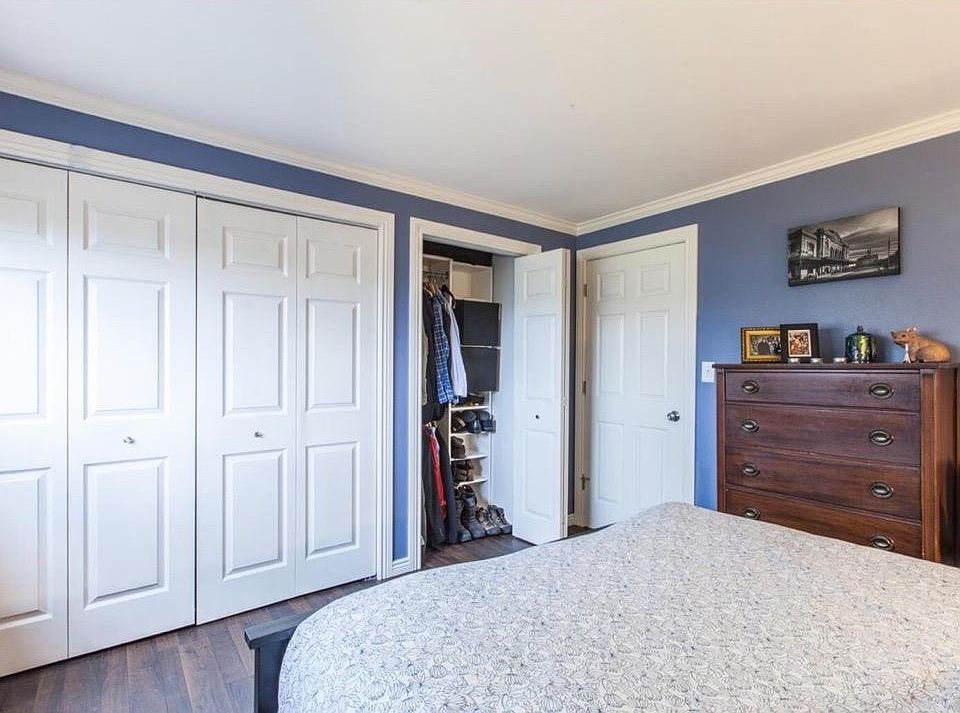 Bedroom closet shown with closed doors.