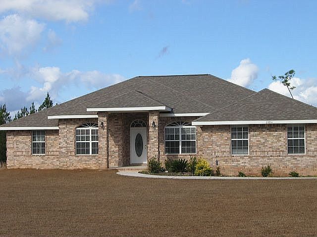 Country Quiet, City Close. This home sits on 1 acre!
