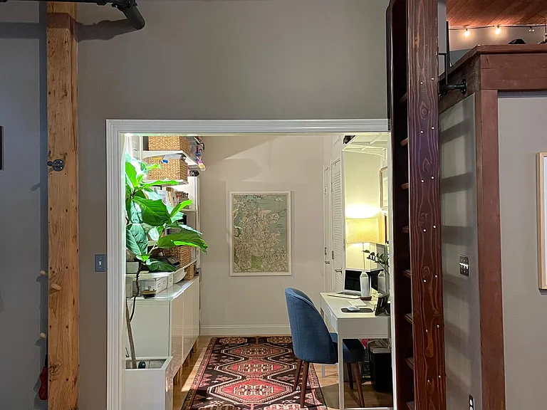 Lofted storage area accessible by built-in ladder (ladder stores against the wall when not in use)