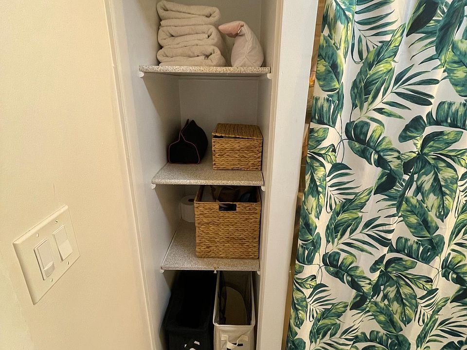 Storage area in bathroom for towels, laundry, etc.