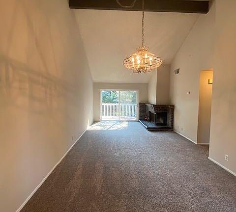 Large living room/dining room with gas fireplace