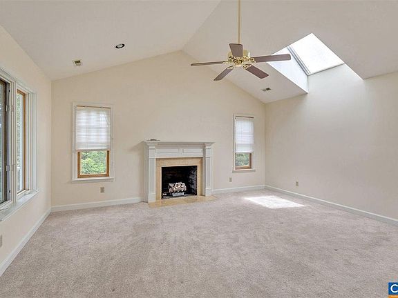 The master bedroom has a cathedral ceiling and a skylight. The fireplace is gas. You have direct access to the upstairs porch on the left, and on the right is a small balcony overlooking the pool, perfect for keeping an eye on the kids.