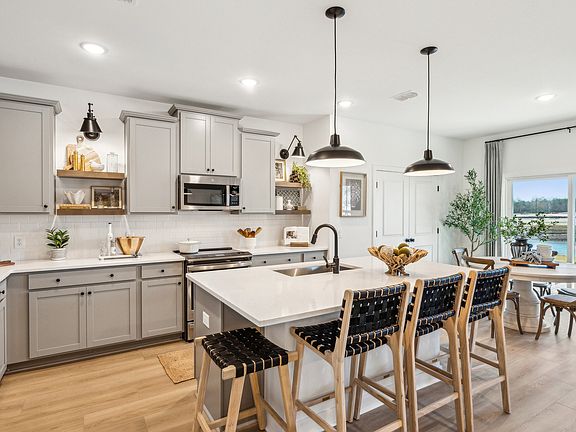 Kitchen with pendant lights over island