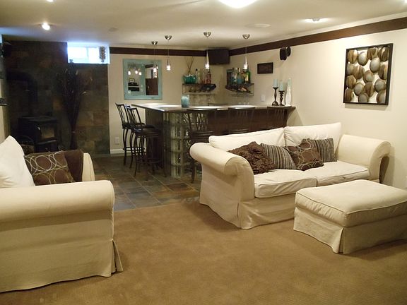 family room with wet bar and wood burning fireplace