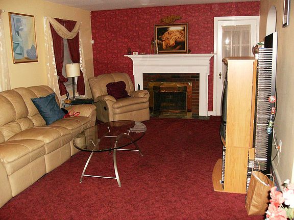 Living Room w/ woodburning fireplace