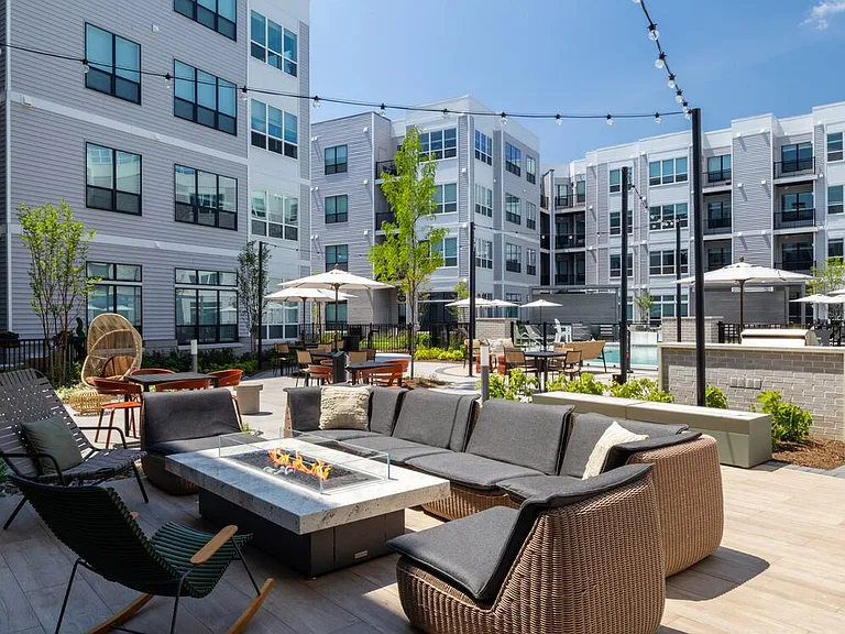 Courtyard with BBQ grills, fireplace, and lounge seating