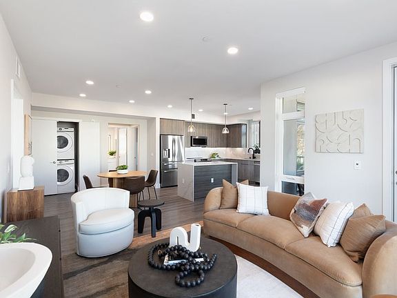 Signature Collection living and dining areas with hard surface flooring throughout