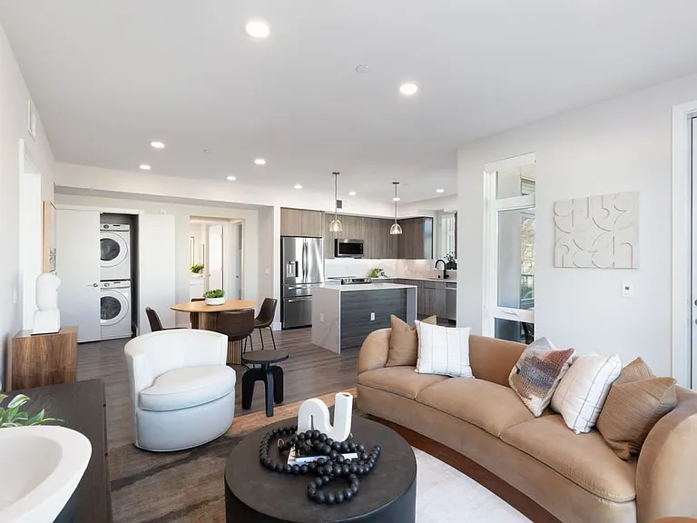 Signature Collection living and dining areas with hard surface flooring throughout