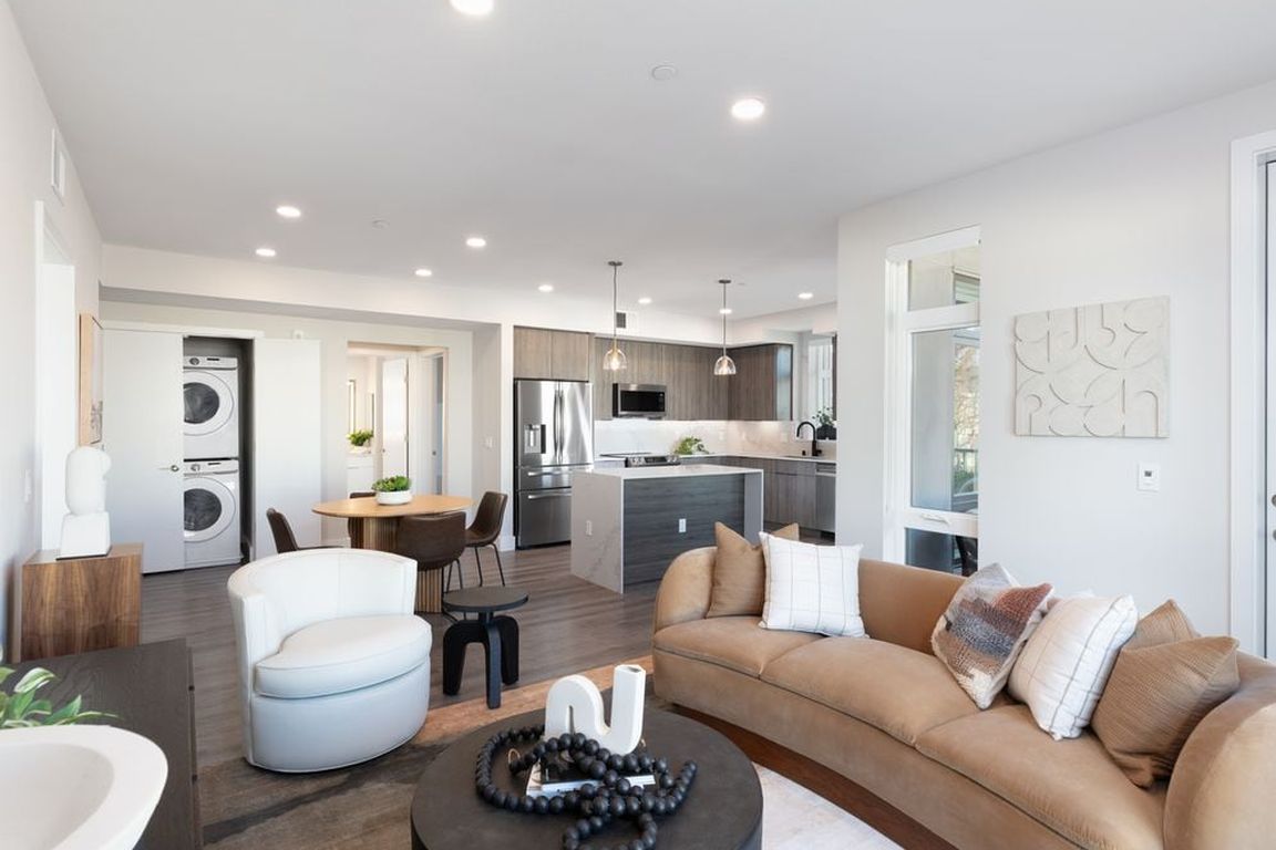 Signature Collection living and dining areas with hard surface flooring throughout