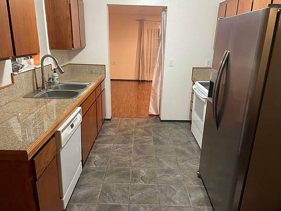 Kitchen looking into formal dining area.