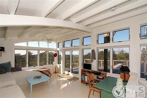 Loft area on second floor leading out to deck.