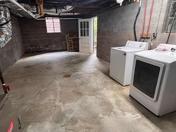 Unfinished basement with W/D.