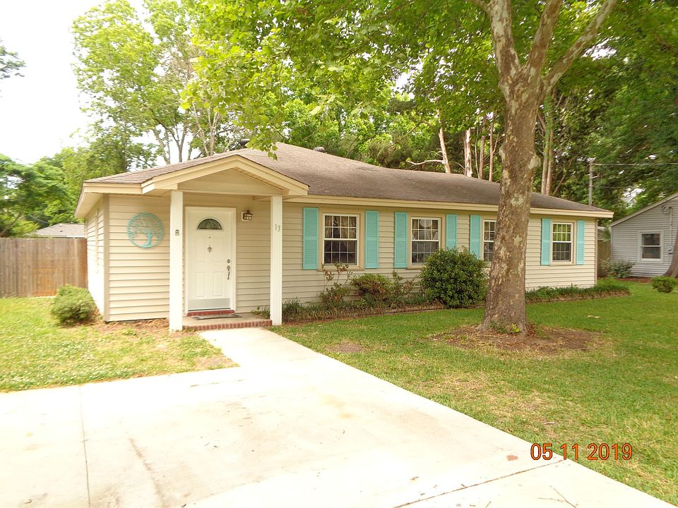 Slab house with large driveway.