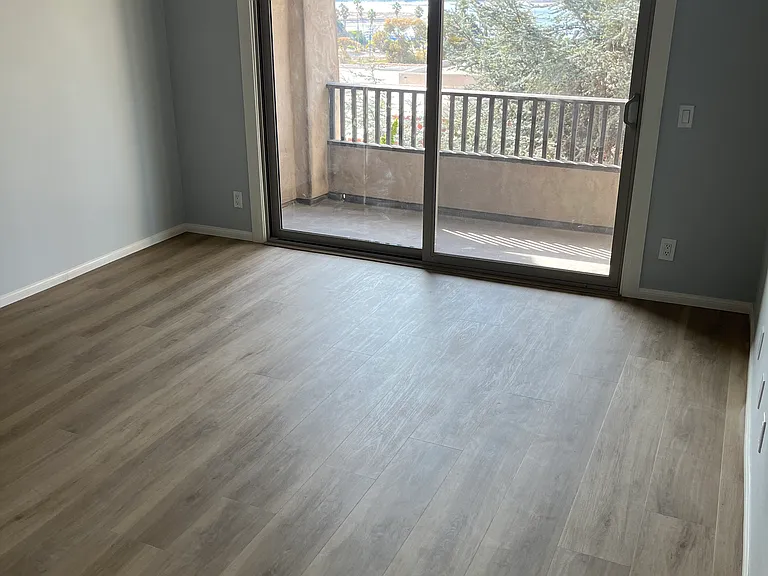 Primary Bedroom with balcony and Mission Bay view