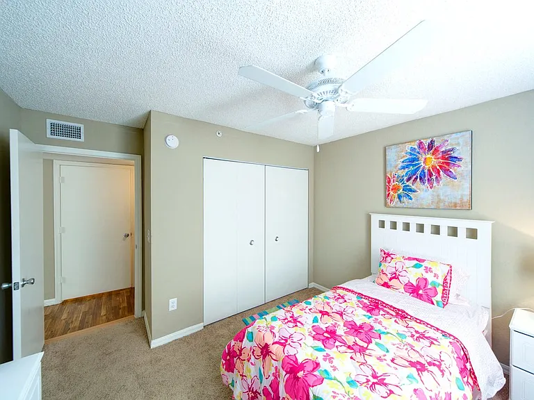 Bedroom with plush carpeting and a ceiling fan at Gregory Cove in Jacksonville, FL