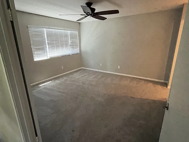 View from upstairs hallway. Guest Bedroom. Double door entry. Remote control ceiling fan.