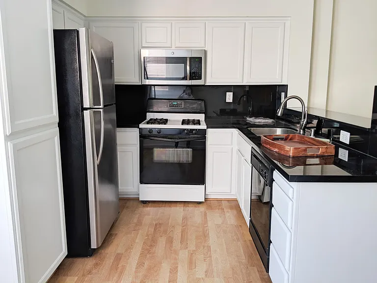 chef's kitchen with granite countertops. new fridge and microwave as of 2016-2017.