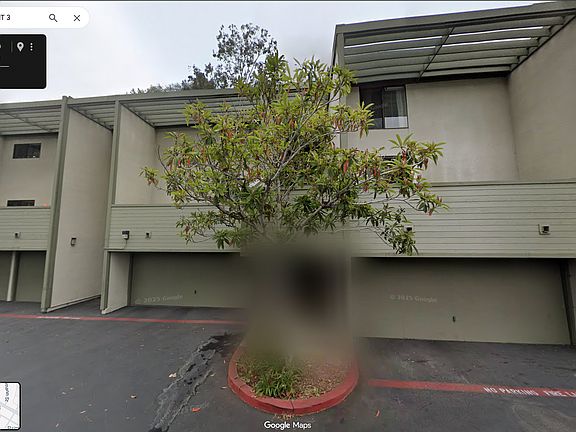 Front of condo - garage is in middle (left side is yours)